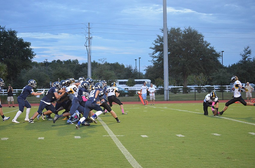 ODA rushed towards the kicker as the Bishop Verot stops them.