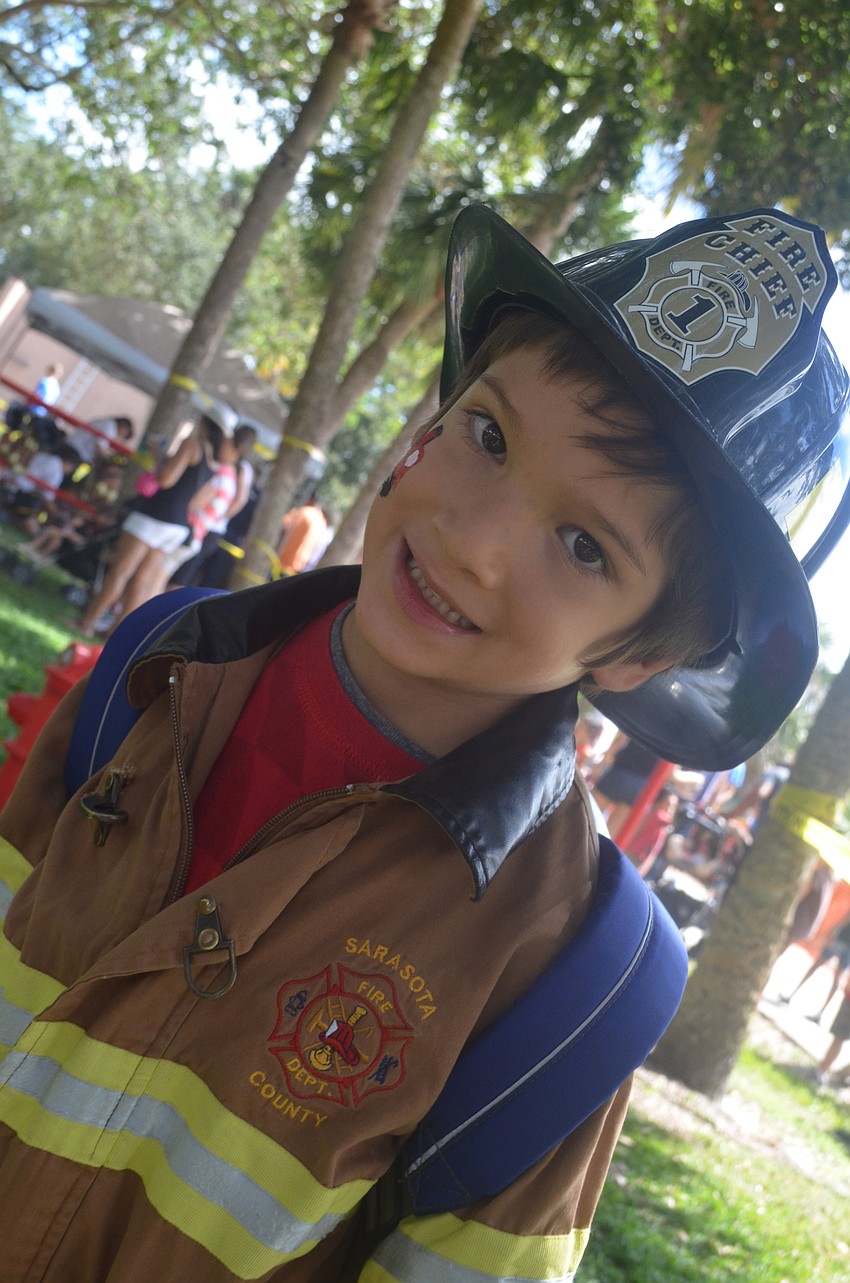 Peter Storino, 5, enjoys playing at the Junior Fireman Combat Challenge.