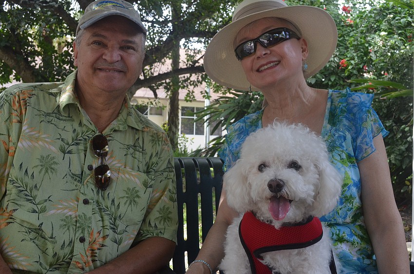 Judy and John Hoover with their 10 â€“ year old Bichon FrisÃ© Baxter