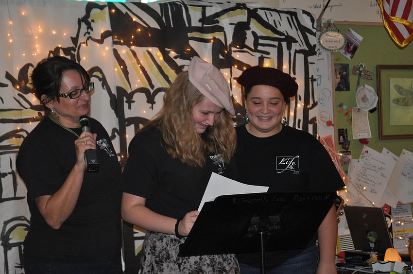 Rose Milner and Peighton Zook read their poem inspired by light and darkness together