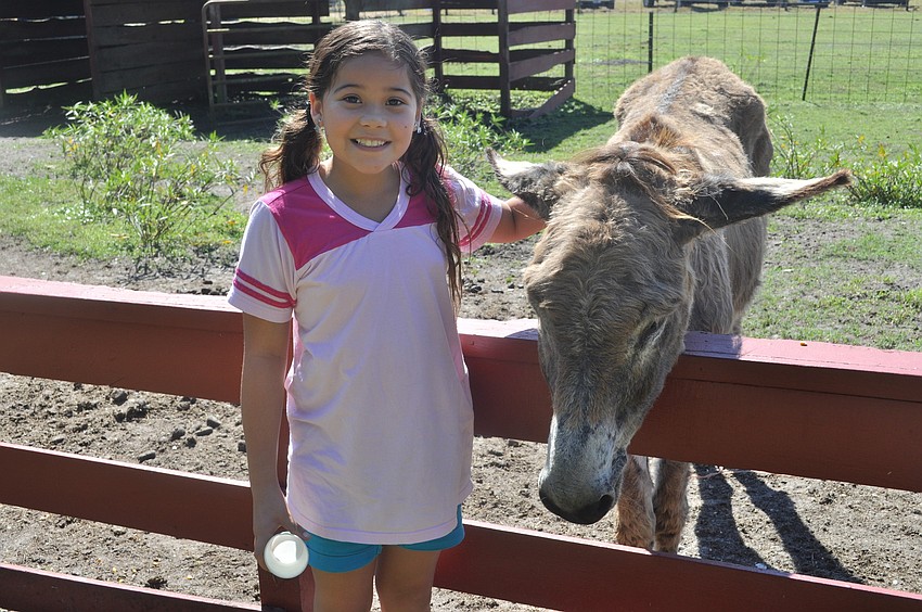Kiana Wilson came from Tampa to see the farm animals, including a donkey.