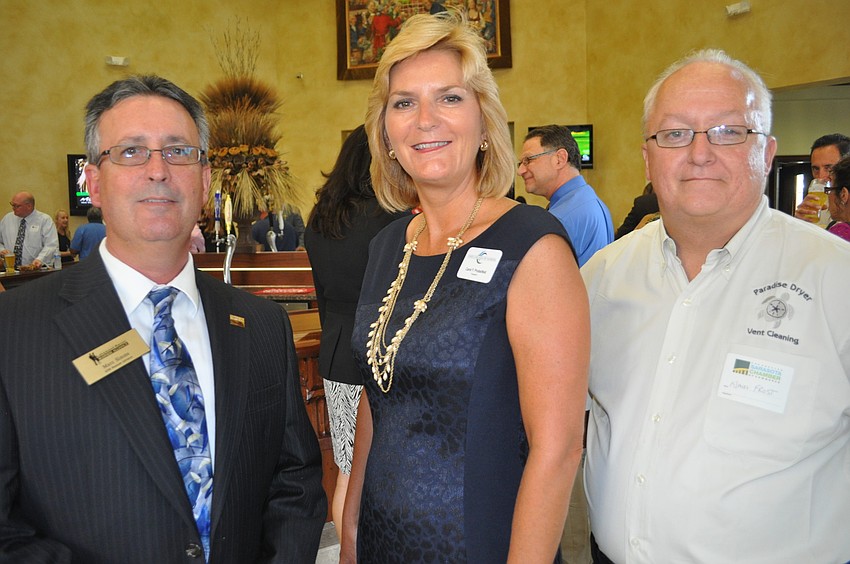 Marc Simms of the Lakewood Ranch Business Alliance with Dr. Carol Probstfeld, president of State College of Florida, Manatee-Sarasota and Klaus Frost of Paradise Dryer Vent Cleaning
