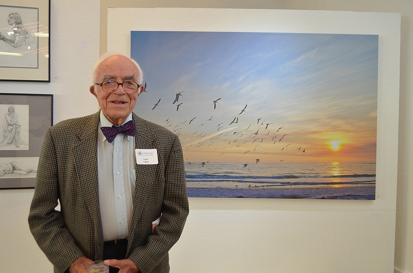 Louis Cabot in front of his work.
