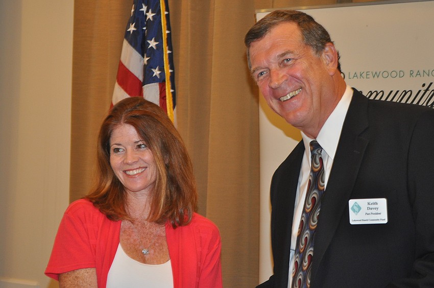 Catherine Peabody, founder of Beyond the Spectrum, accepted a grant from Keith Davey of the Lakewood Ranch Community Fund.