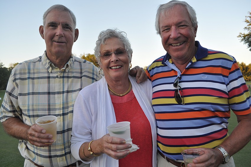 Canadians Tim Peat, winner of the regatta on the lake, his wife, Rita, and Gary Brule