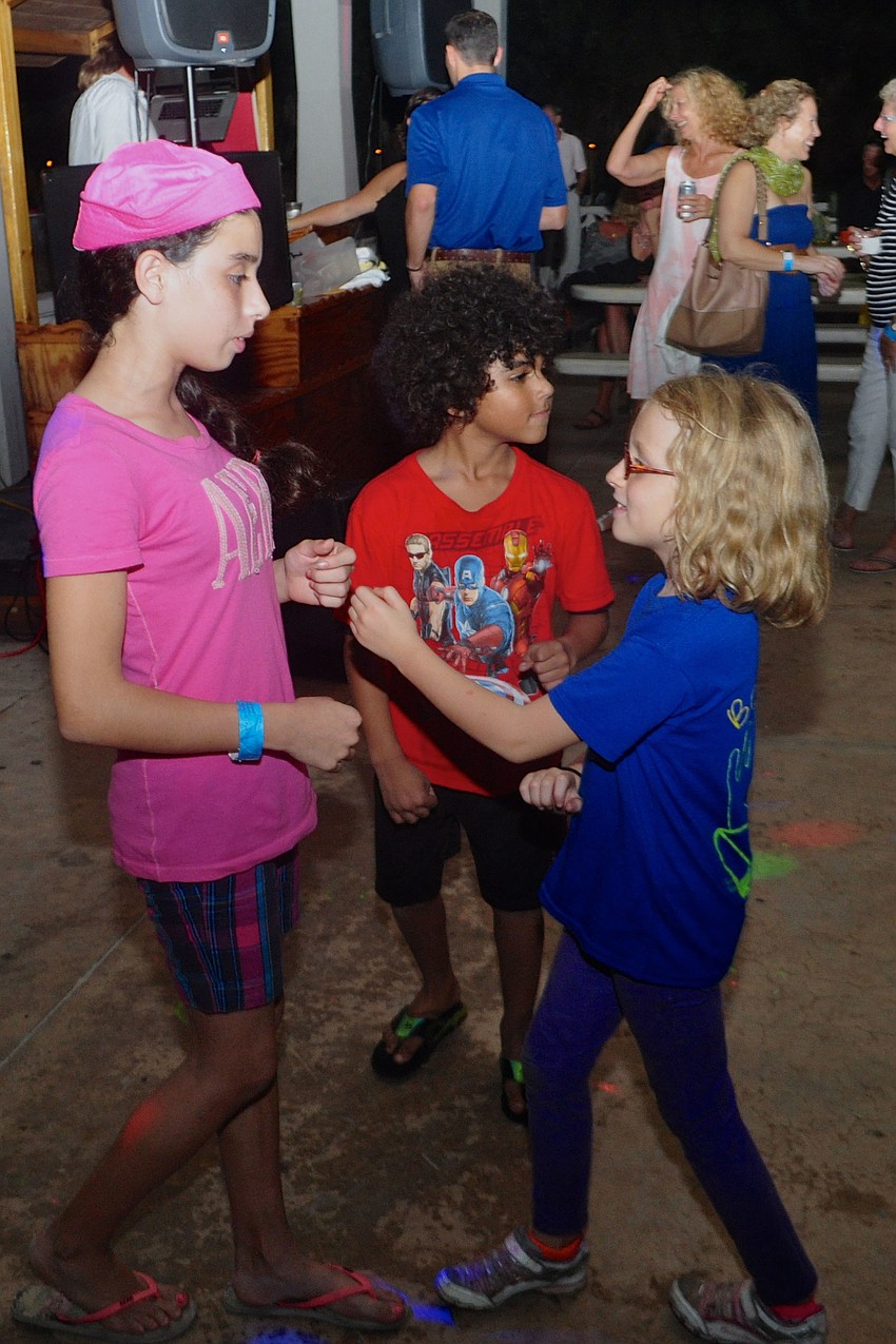 Crissy Gonzalez, 12, Daâ€™monee Goley, 6, and Sofia Lendo, 8, groove on the dance floor.