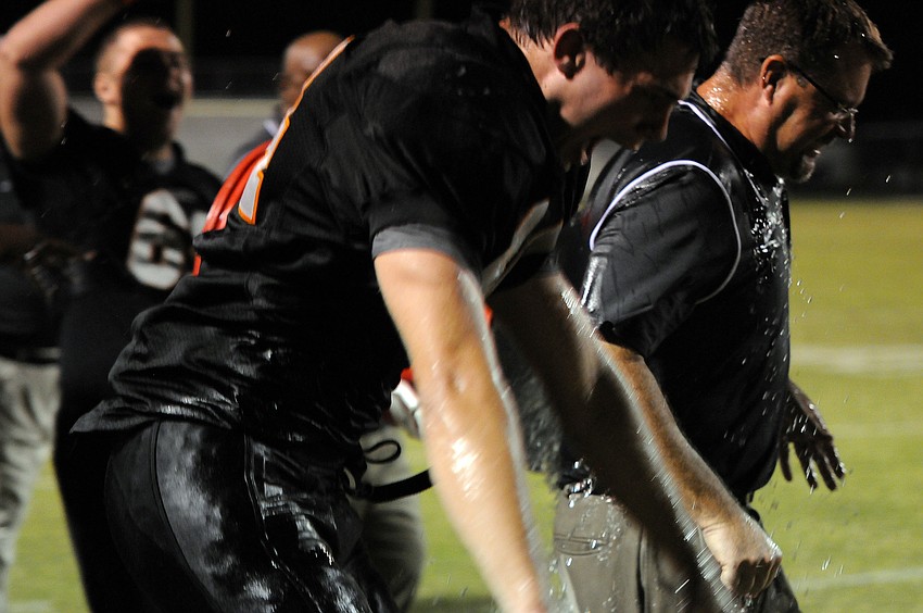 Sarasota High football coach Ed Volz receives an ice bath following his teamâ€™s 41-14 victory over Lakewood Ranch Nov. 1.