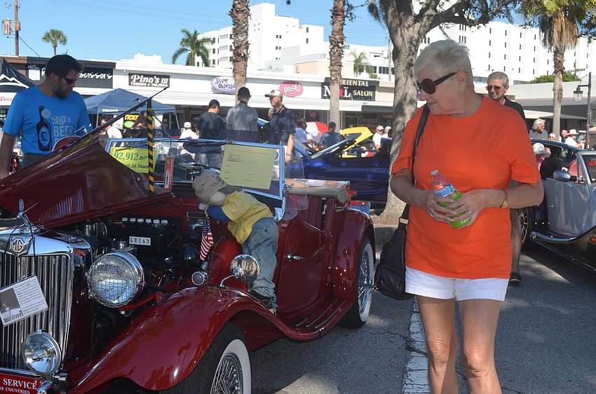 Angie Orlando admires a 1951 MG TK MDS