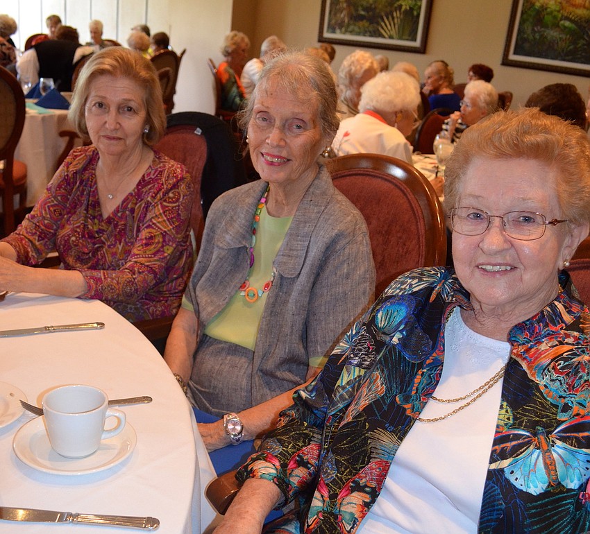 Gal pals Sandy Ciampa, Nancy Page and Marge Jones wait for the fashion show to begin.