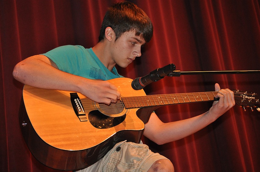 Kyle Funk strummed the guitar to â€œBeneath Your Beautiful.â€