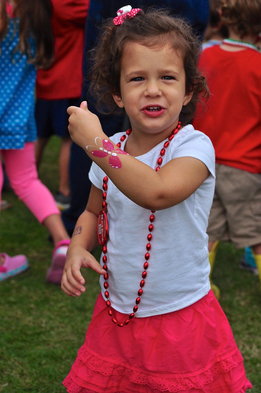 Sadi Rodman, 2, shows off her temporary body art.