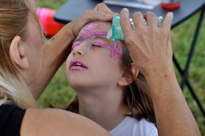 Holly Greer, 6, waits to see her new face for-a-day.