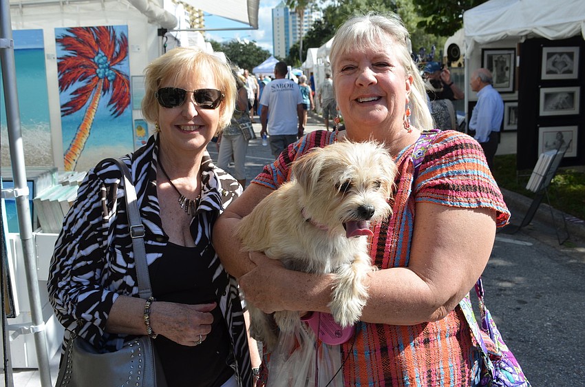 Marti Rieszer and Becky Braddock with Sadie the chorkie