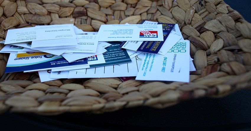 Business card drop at the sign-in table.