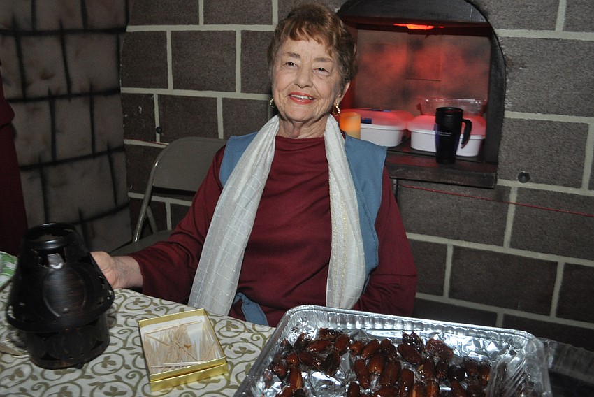 Elaine Seamon serves guest baklava and dates.