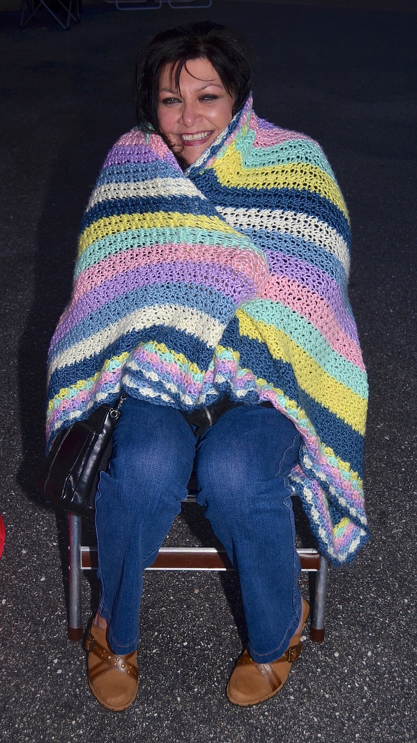 Julie Brooks bundles up before the concert begins.