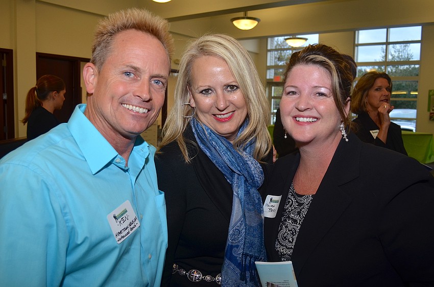 Ken Burke, Carol Banach and Melissa Brady cozy up.
