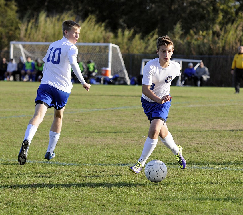 Sarasota Military Academyâ€™s Connor Moriarty pushes the ball down the field for the Eagles in the first half.