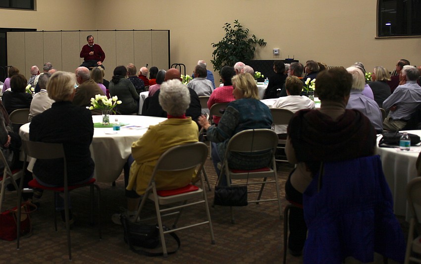 The crowd laughs as H. Terrell Griffin describes his colorful characters inspired by Longboat Key residents.