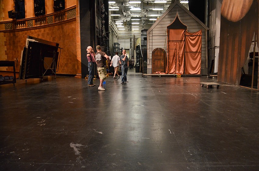 The backstage crew prepares to load-in the sets