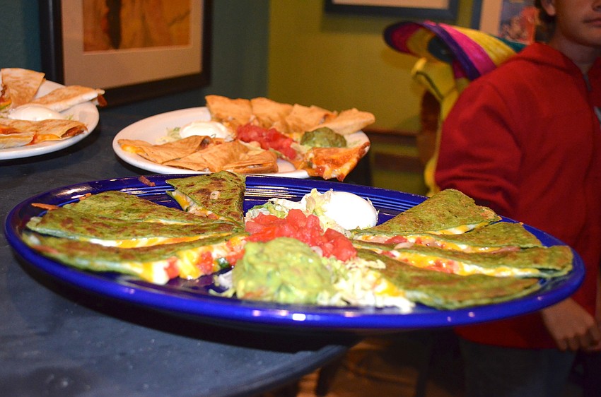 Social goers enjoy quesadillas, among other Mexicali dishes.