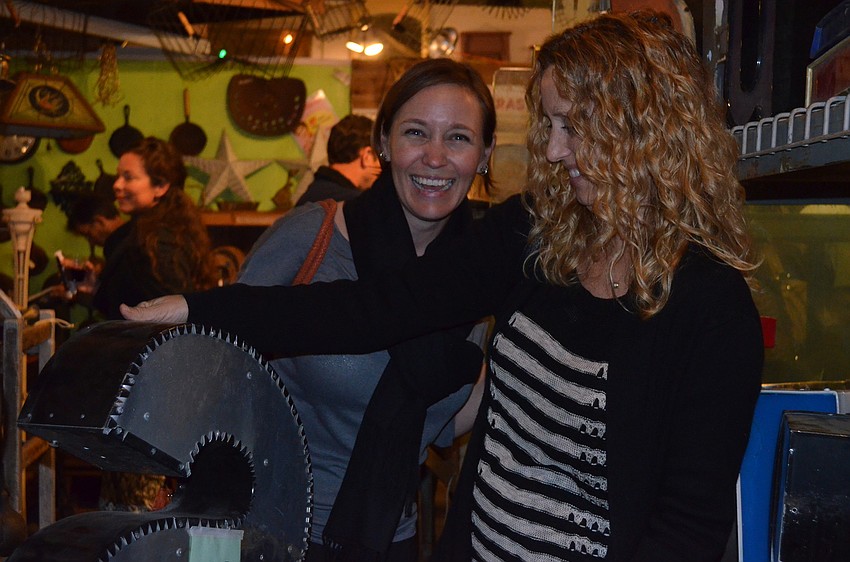 Debbie Dietz and Arin Jackson rummage through letters.