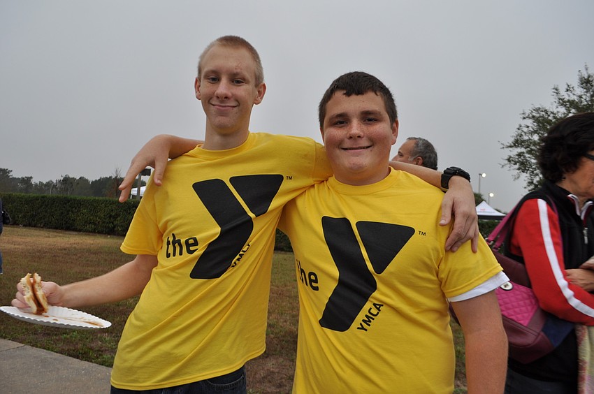 Lakewood Ranch High School JROTC cadets Aaron Polachek and Brett Melton volunteer.