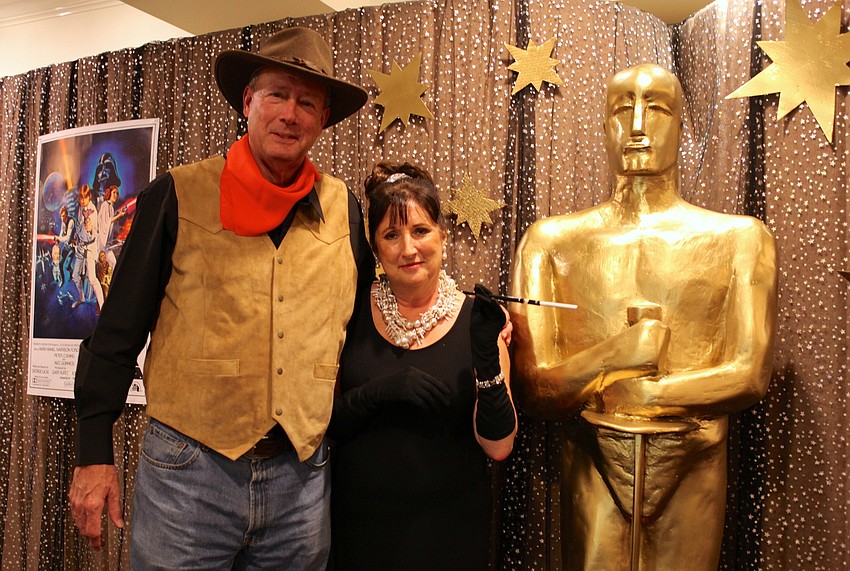 Lee and Jan Peakes pose with a handmade Oscar statue.