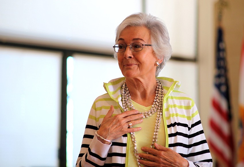 Anna Stankiewicz wears a few layered necklaces to add texture to her outfit.