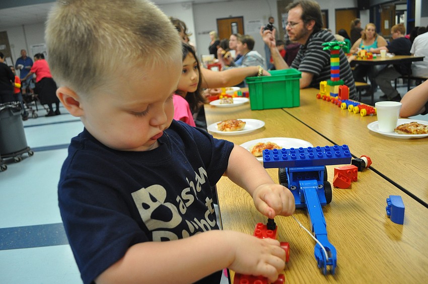 Jarrett Williams, a two-year-old future Bashaw student, worked hard on his Lego creation.