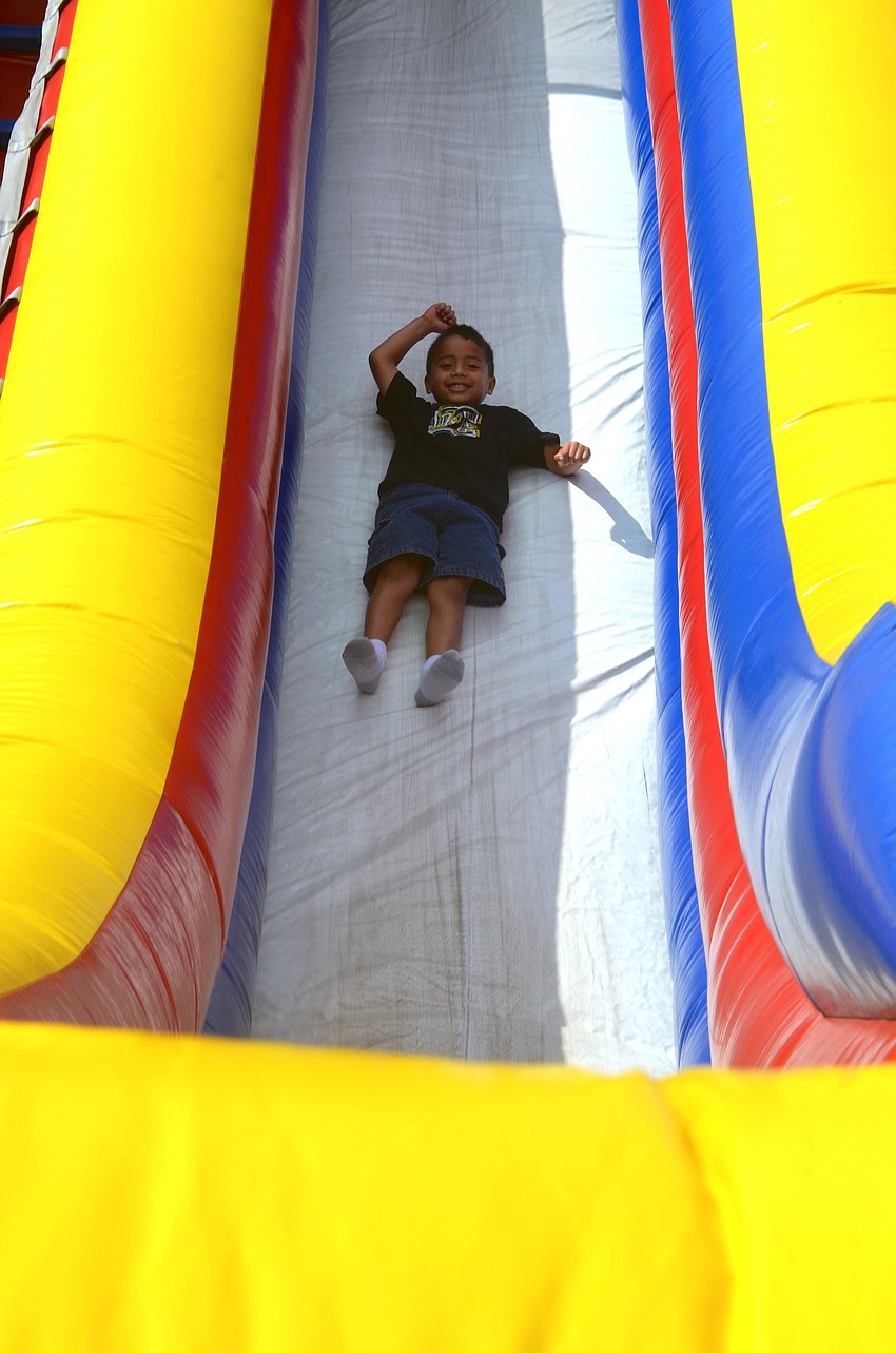 Five-year-old Yaniel Lopez can't get enough of the inflatable slide.