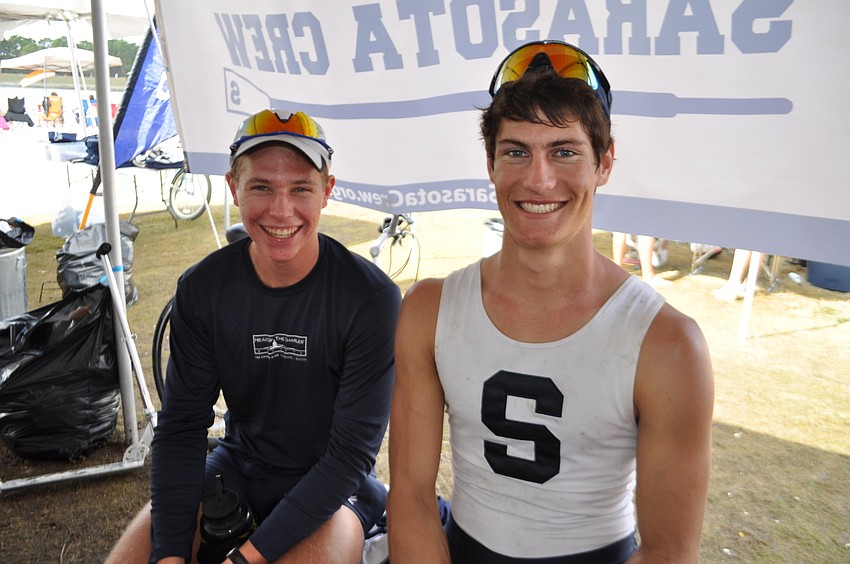 Sarasota Crew members Nick Edwards and Travis Taaffe rehydrate between races.