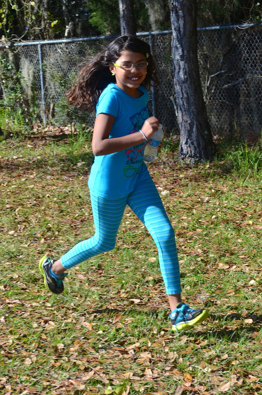 Ten-year-old Daniela Ramos breaks away from her friends and jogs.
