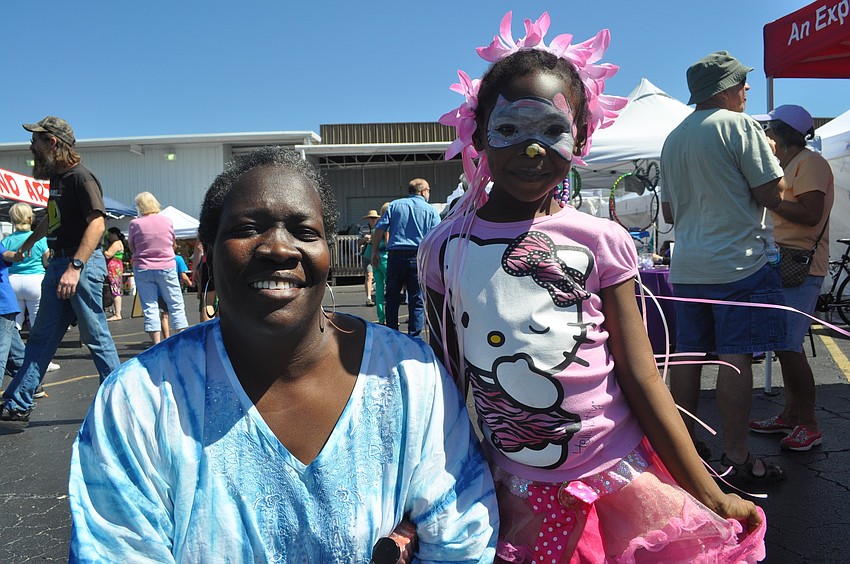 Betty McNeal, with her daughter, Mariia, 5, enjoyed the bungee jump and face paint the most.