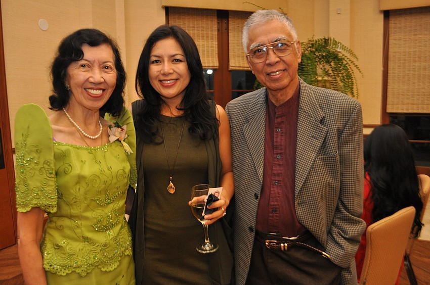 Caring and Ramon Santos attend with their daughter, Cori Hvideberg, center.