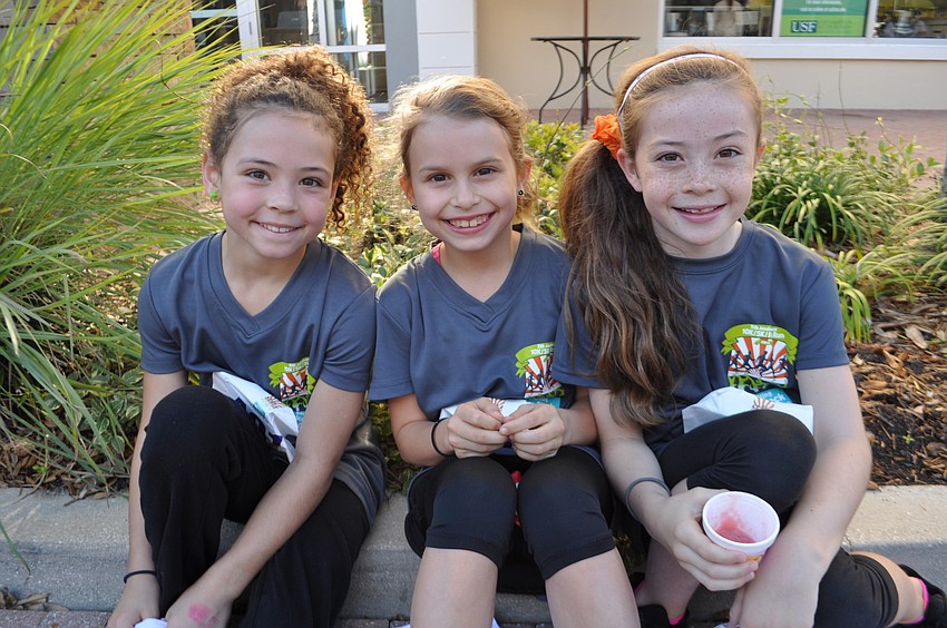 East County children Lilly Lynch, Sophia Colombo and Morgan Earp rest after the race.