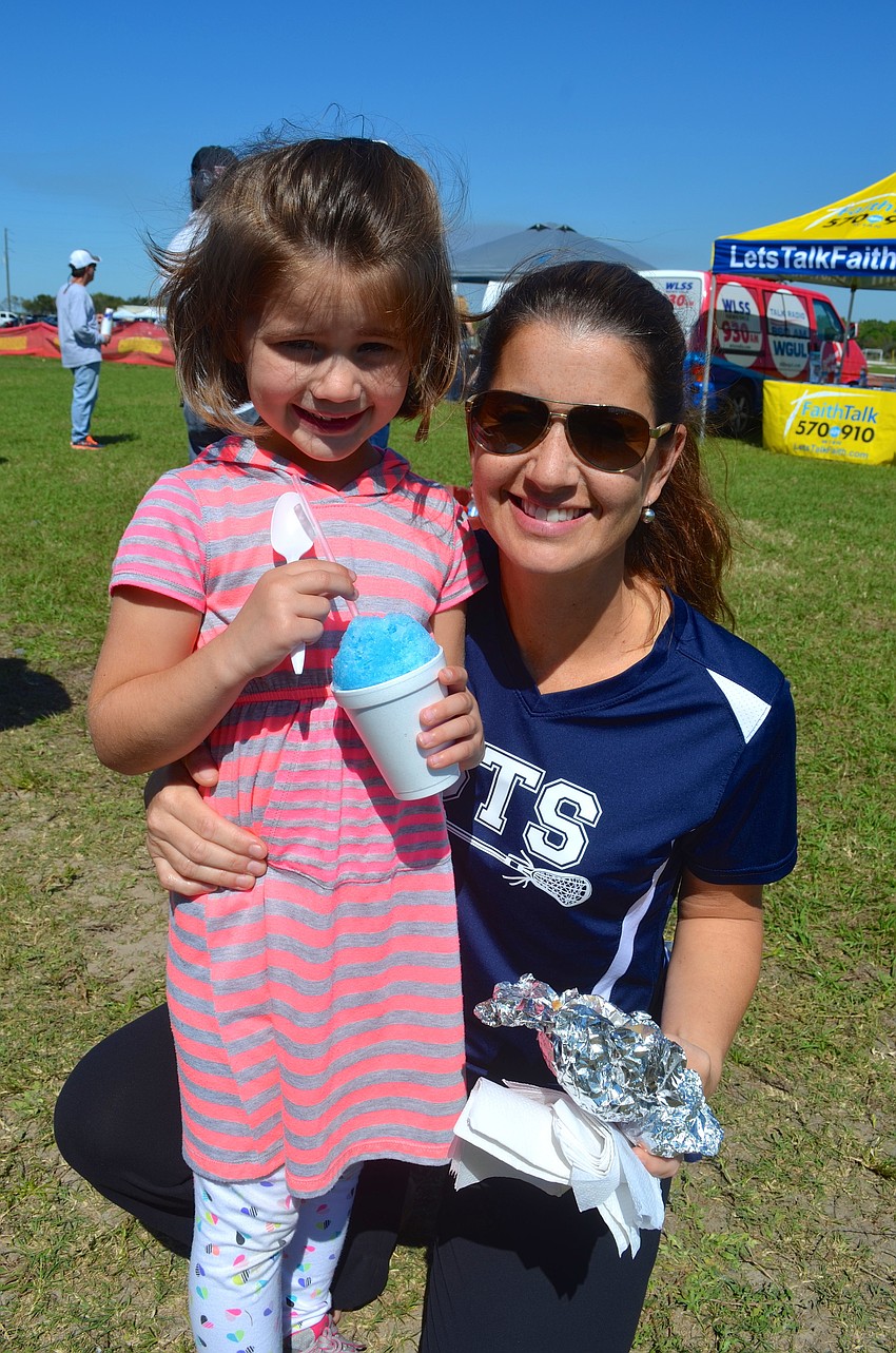 Georgi McGonnigal and her mother, Kristina, enjoy an afternoon in the sun.