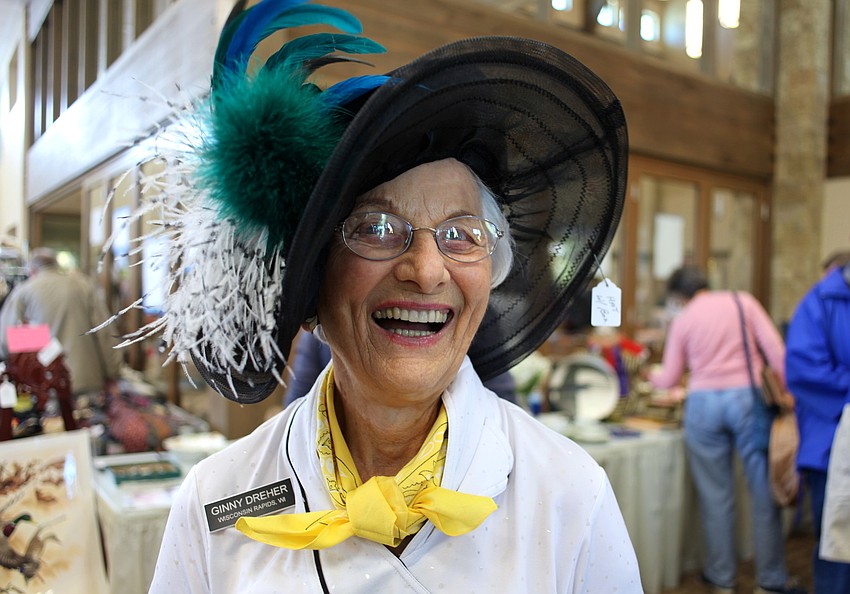 Ginny Dreher wears a hat from her boutique section at the Sale Away.
