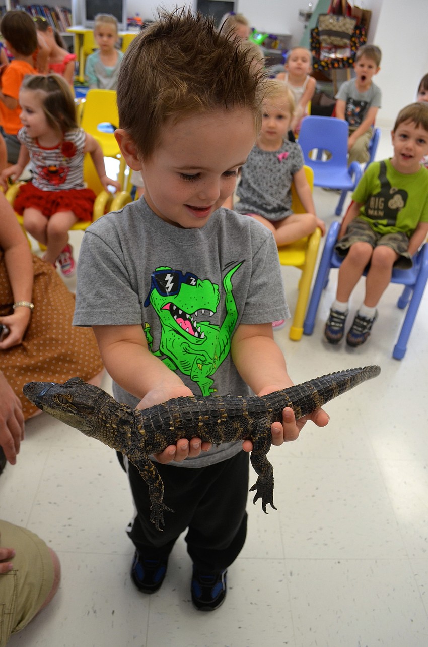 Andrew Williams, 4, spends time with a new friend.
