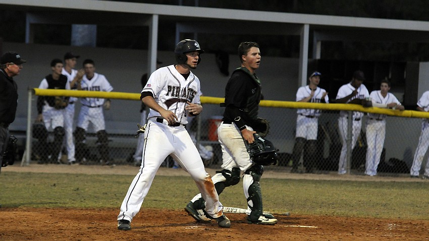 Braden Riverâ€™s Derrick Cozzette looks back to the infield after scoring the Pirates first run of the game.