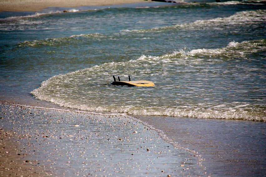 Surfers at Lido Beach.