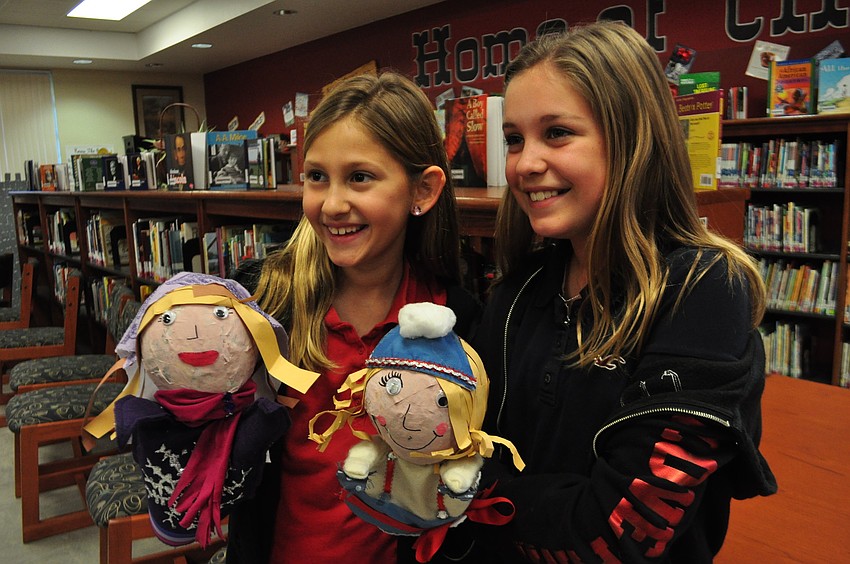 Caroline Pope and Zoe Polivchak are happy with their Russian villager puppets.