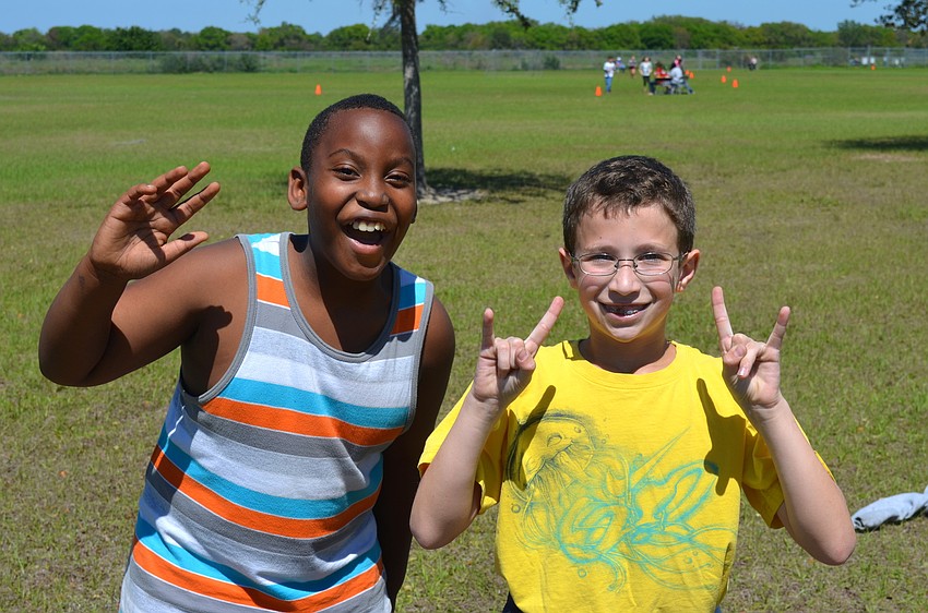 Lavelle Saenz, 10, and Tyler Strum, 10, love having their picture taken.