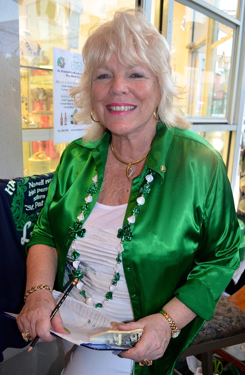 Glenda Graus welcomes patrons as they enter the pub.