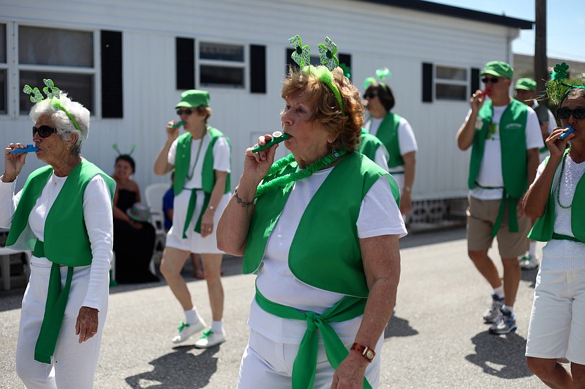 The Blarney Bunch marches and plays their kazoos throughout the parks.