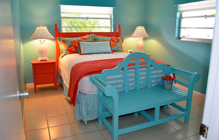 A colorful bedroom welcomes guests.