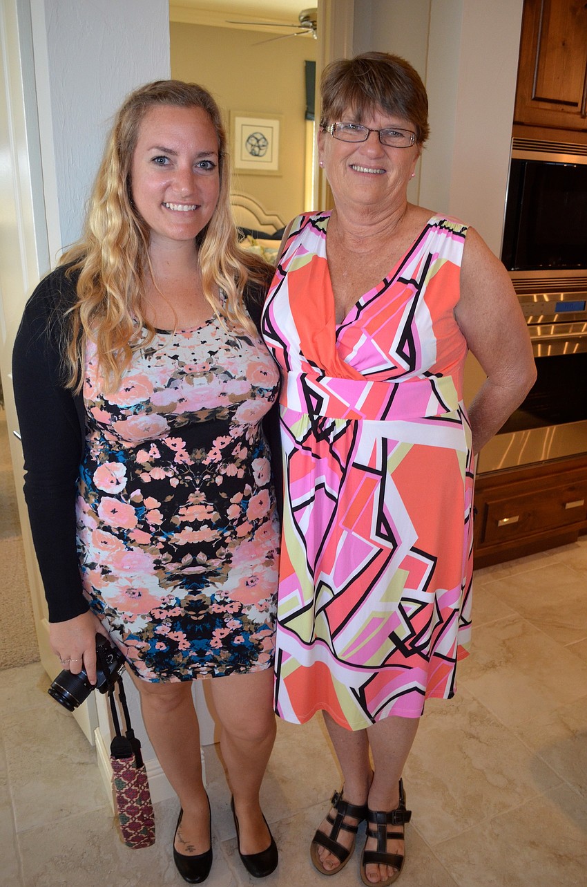 Sierra Lifsey and Carolyn Marchbank show off dresses and black high heels.