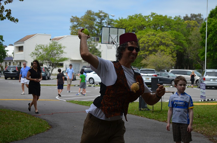 Rabbi Brenner Glickman plays at the dunk tank.