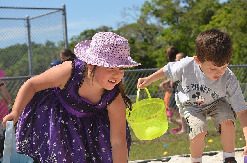 Michelle Kozel searches for eggs.