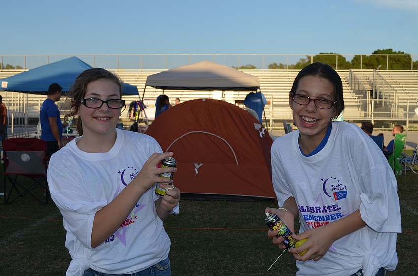 Kaitlyn Freeman and Elena Figueroa play with silly string.